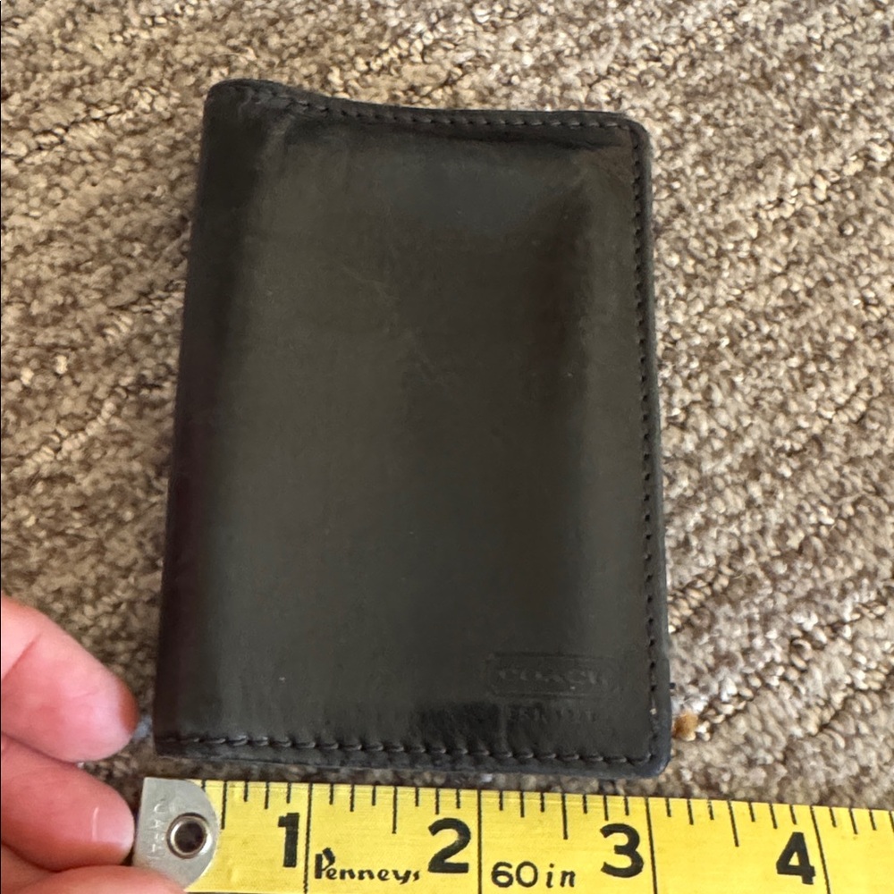 Black vintage Coach wallet with supple black leather. Perfect for credit cards.
